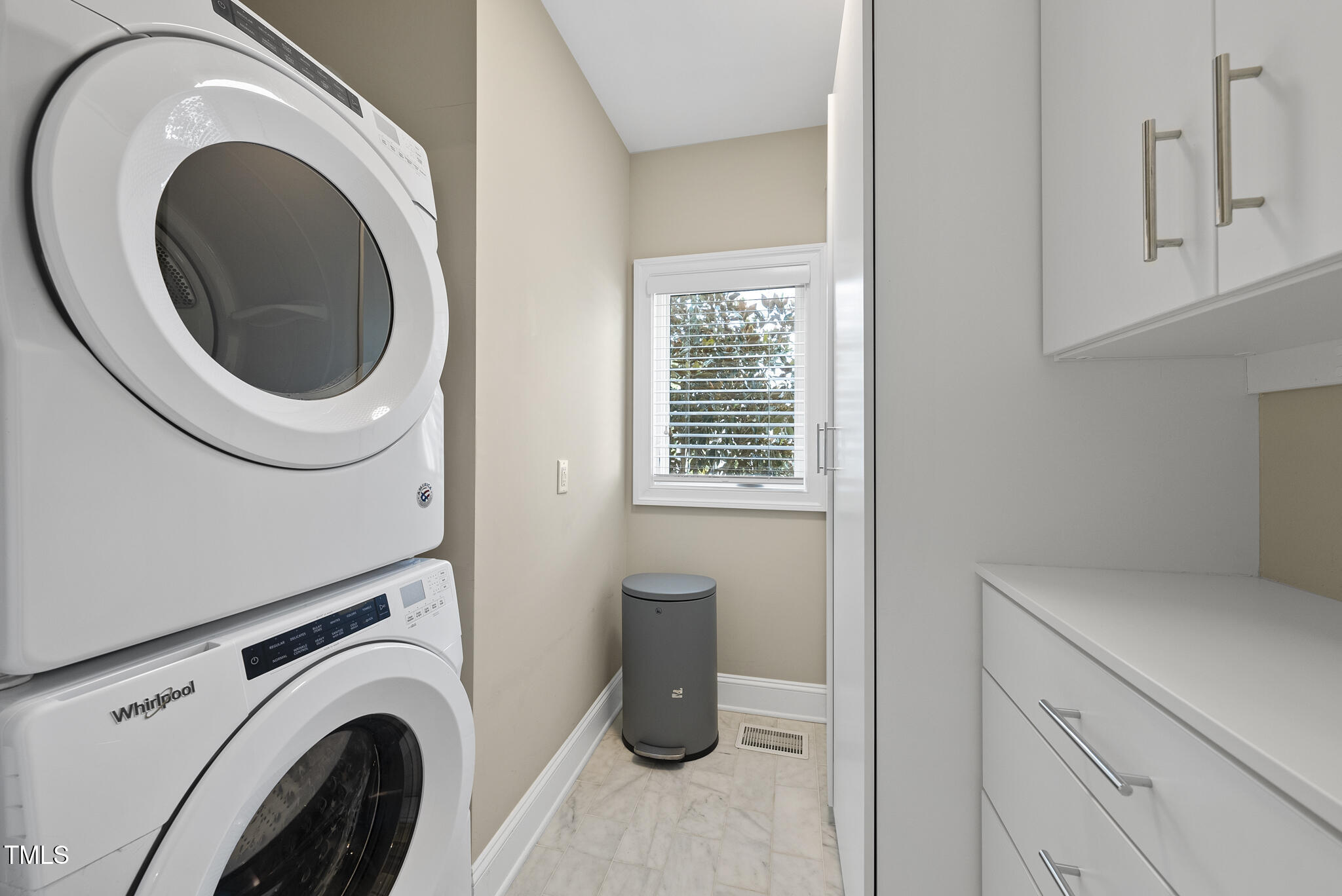606 Daniels Street, Unit B Raleigh, NC 27605 - Photo 8 of 27 a close view of a utility room with dryer and washer