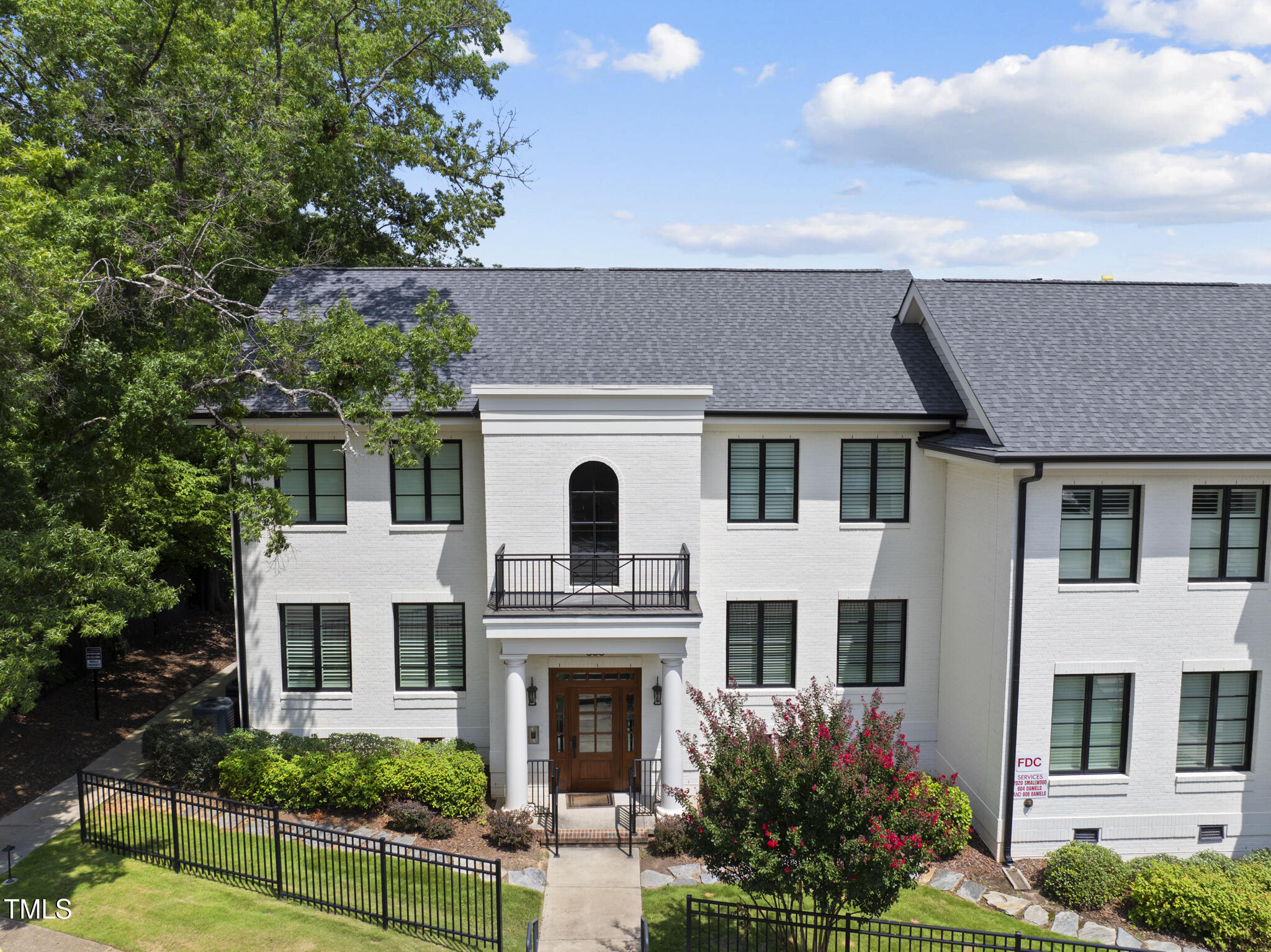 606 Daniels Street, Unit B Raleigh, NC 27605 - Photo 10 of 27 a front view of a house with a yard