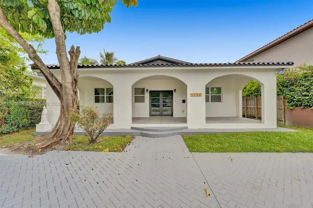 a front view of a house with a porch