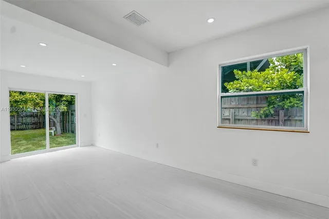 a view of a room with a large window