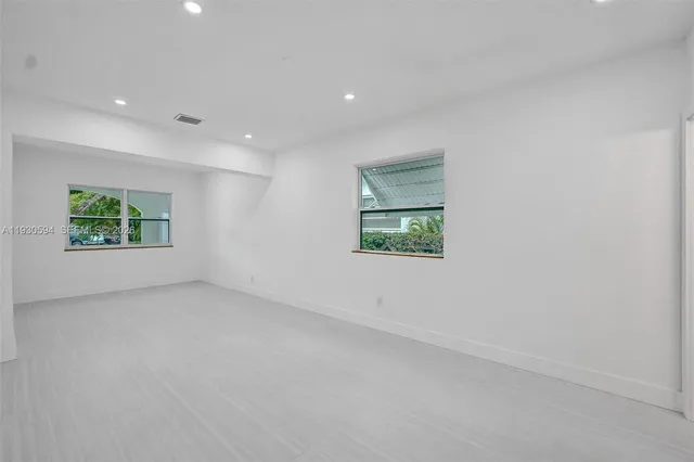 an empty room with windows