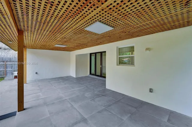 a view of a house with backyard and porch