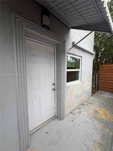 a view of a kitchen with a sink stainless steel appliances and cabinets
