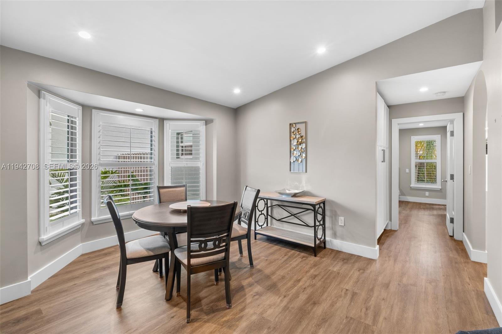 22239 Southwest 98th Place Cutler Bay, FL 33190 - Photo 11 of 67 a dining room with furniture and wooden floor