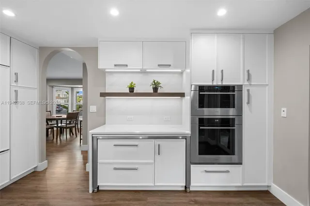 a bathroom with a sink a mirror and a shower