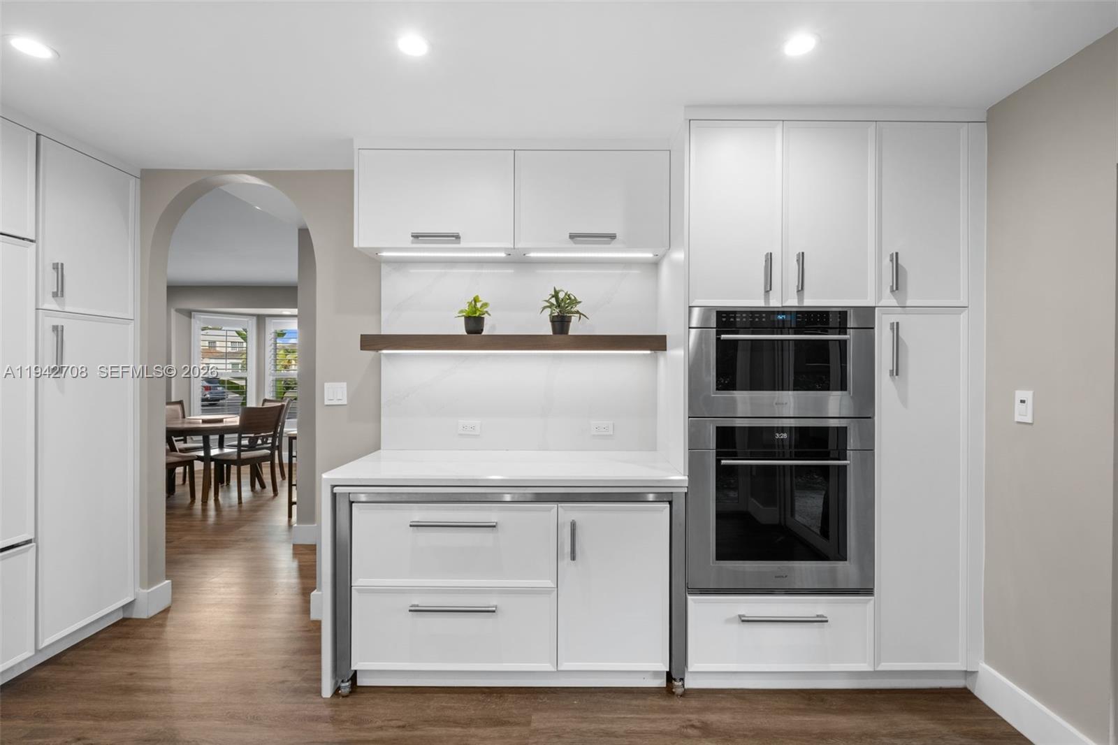 22239 Southwest 98th Place Cutler Bay, FL 33190 - Photo 15 of 67 a kitchen with white cabinets and white appliances