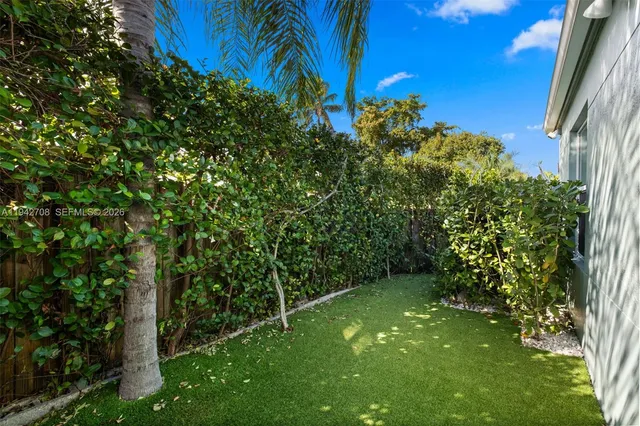 a view of a backyard with swimming pool