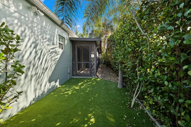 a view of a house with backyard porch and sitting area