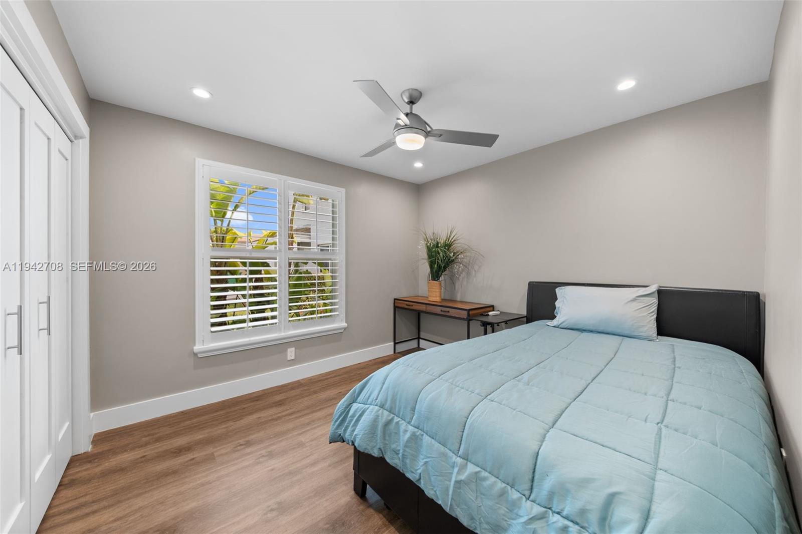 22239 Southwest 98th Place Cutler Bay, FL 33190 - Photo 31 of 67 a bedroom with a bed and a window