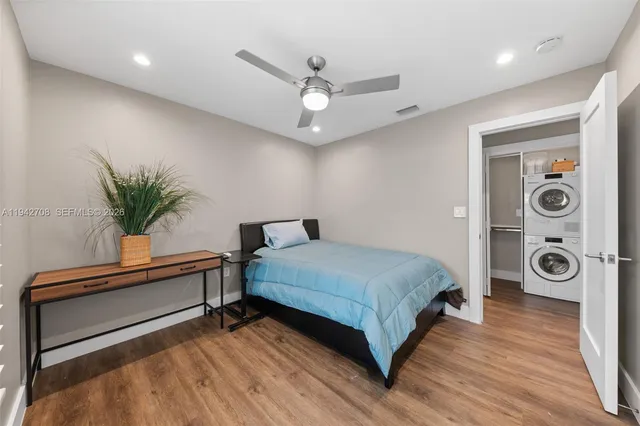 a view of bathroom with a sink a toilet and a mirror