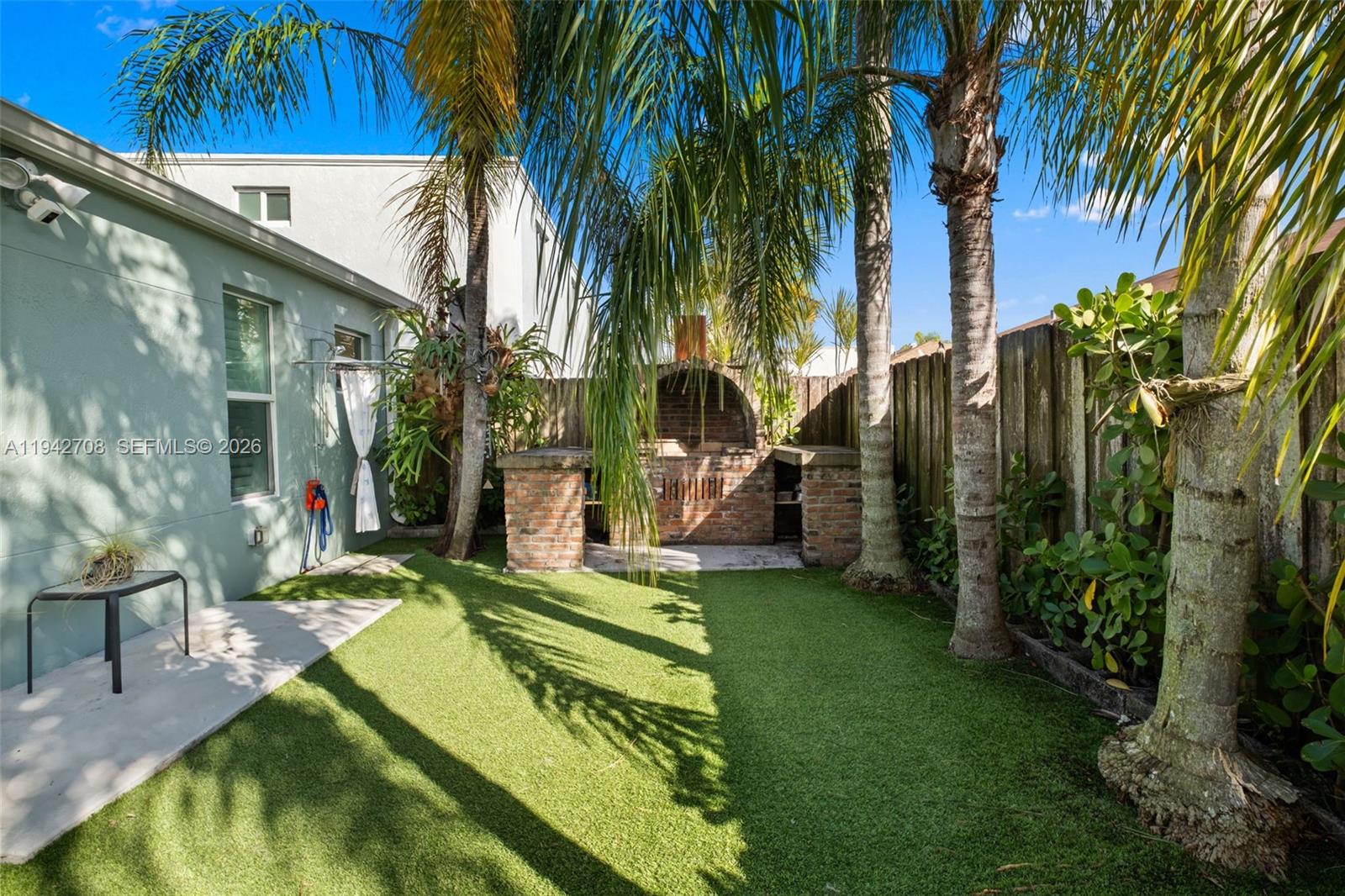 22239 Southwest 98th Place Cutler Bay, FL 33190 - Photo 34 of 67 a view of a backyard with swimming pool