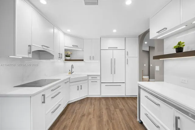 a bedroom with a bed window and a flat screen tv