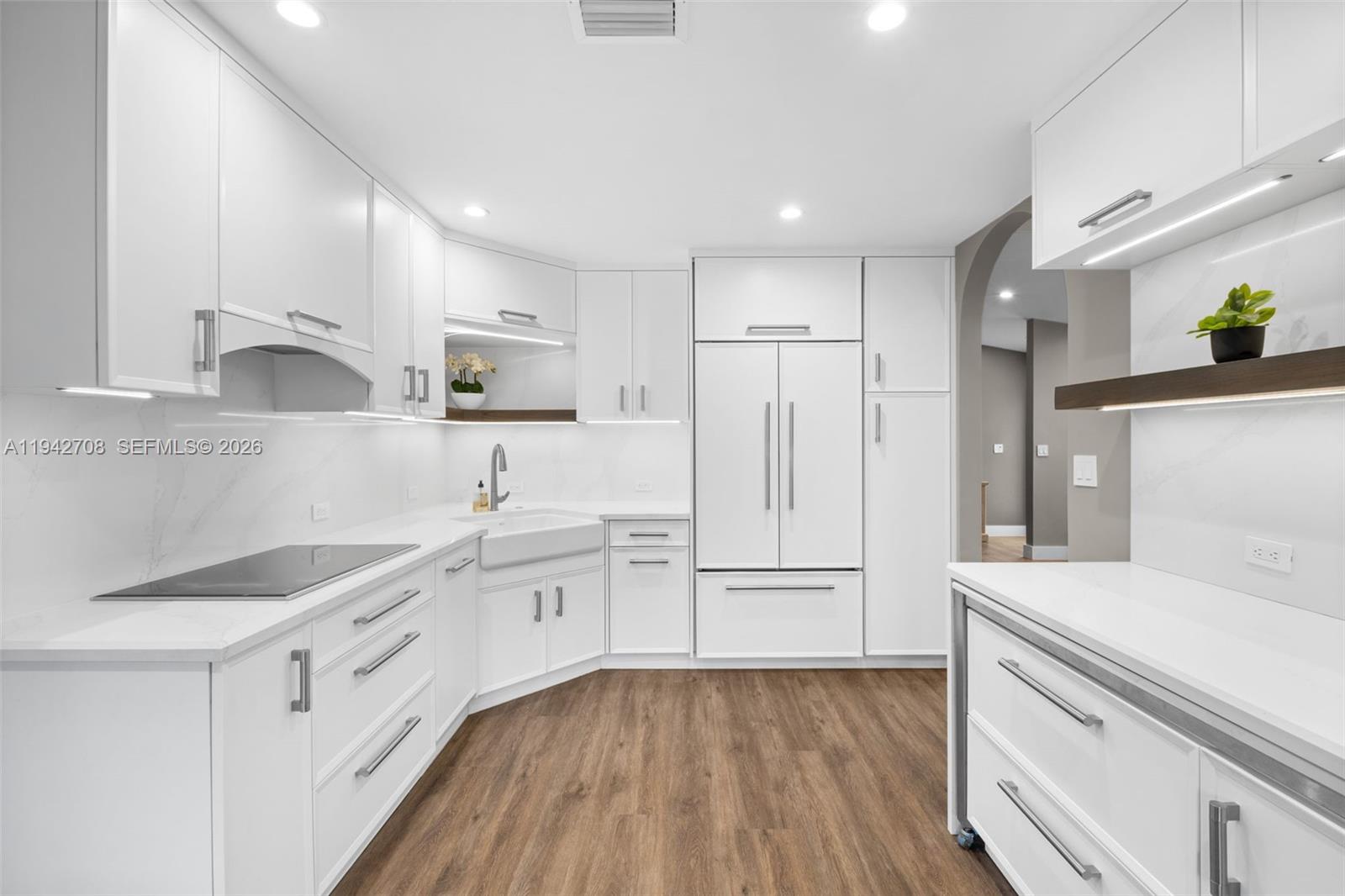 22239 Southwest 98th Place Cutler Bay, FL 33190 - Photo 4 of 67 a kitchen with white cabinets and white appliances