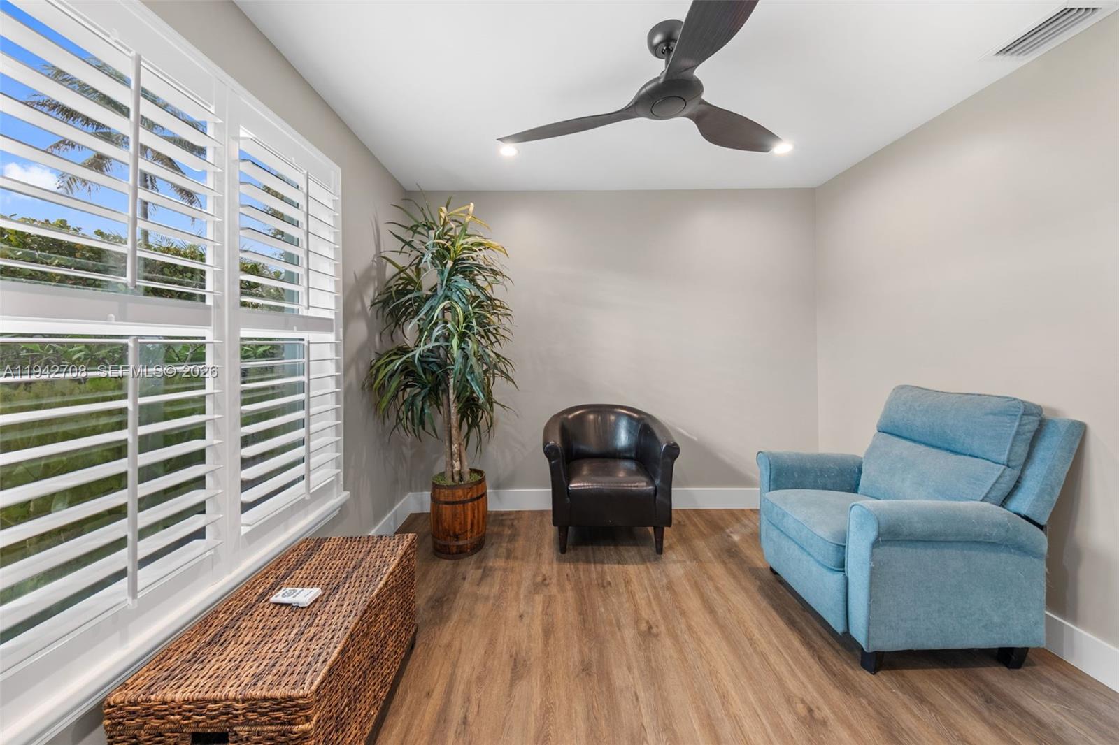 22239 Southwest 98th Place Cutler Bay, FL 33190 - Photo 42 of 67 a living room with furniture and a potted plant