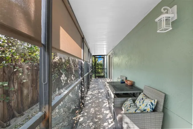 a bedroom with a bed and a flat tv screen on dresser