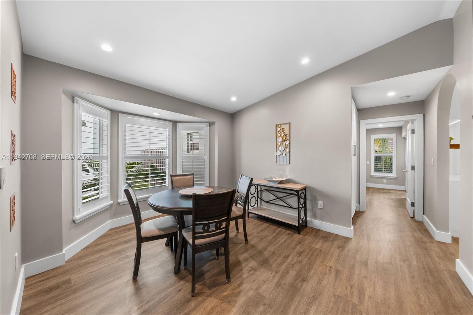 22239 Southwest 98th Place Cutler Bay, FL 33190 - Photo 49 of 67 a dining room with furniture and wooden floor