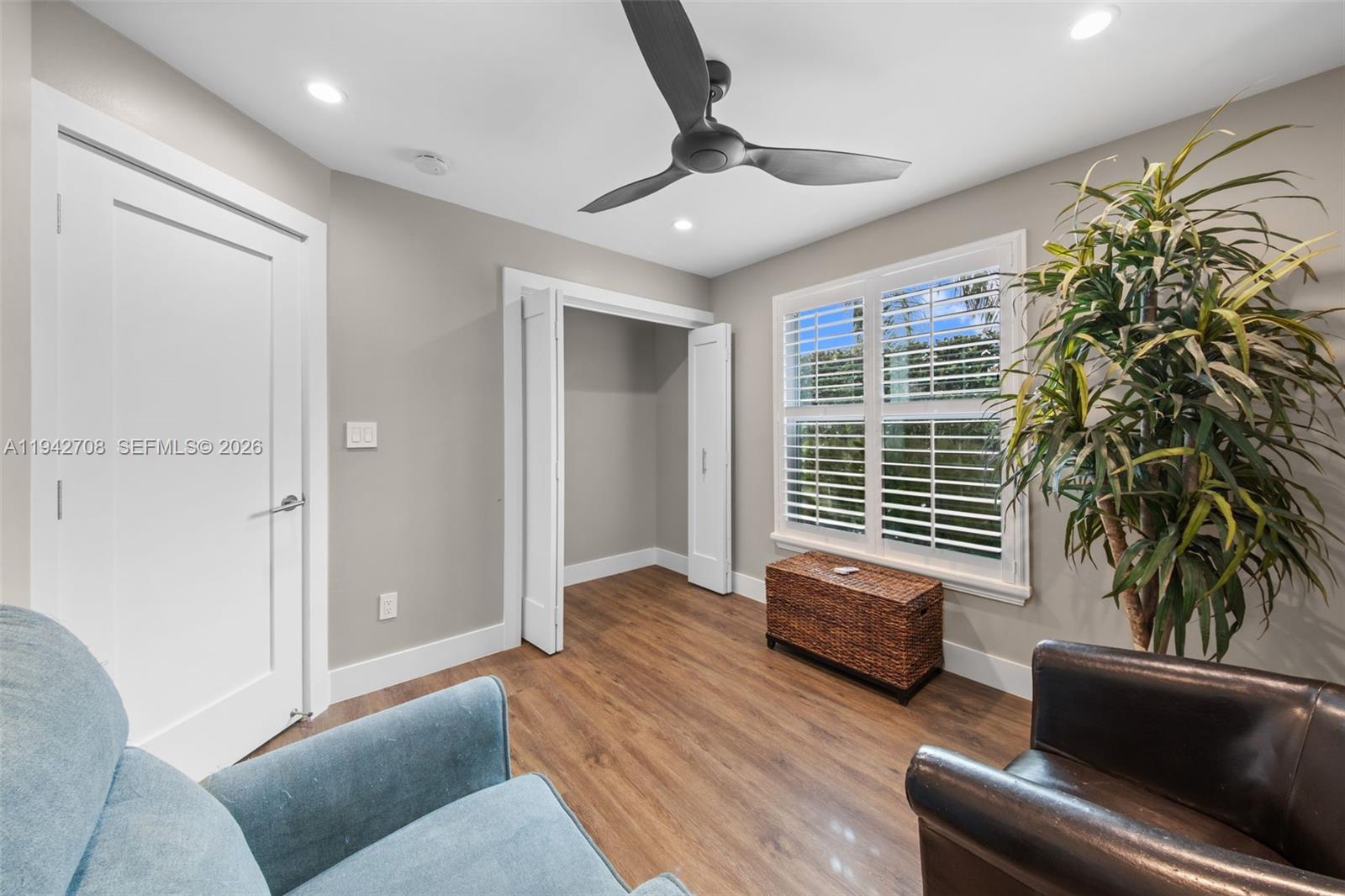 22239 Southwest 98th Place Cutler Bay, FL 33190 - Photo 51 of 67 a living room with furniture and a window