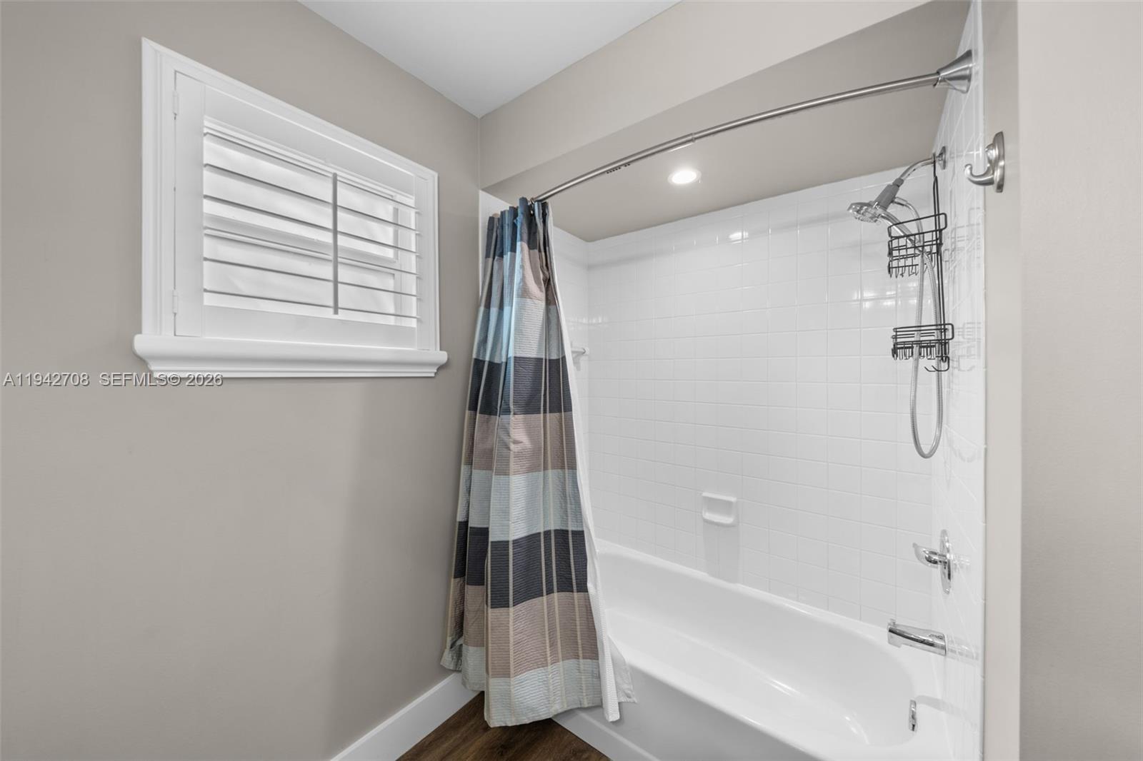 22239 Southwest 98th Place Cutler Bay, FL 33190 - Photo 53 of 67 a bathroom with a bathtub and a shower