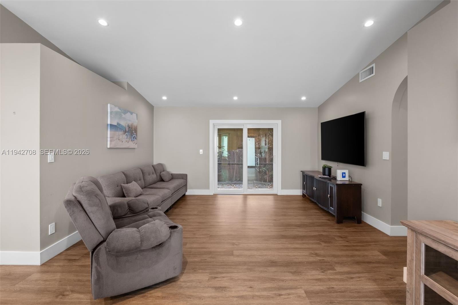 22239 Southwest 98th Place Cutler Bay, FL 33190 - Photo 9 of 67 a living room with furniture and a flat screen tv