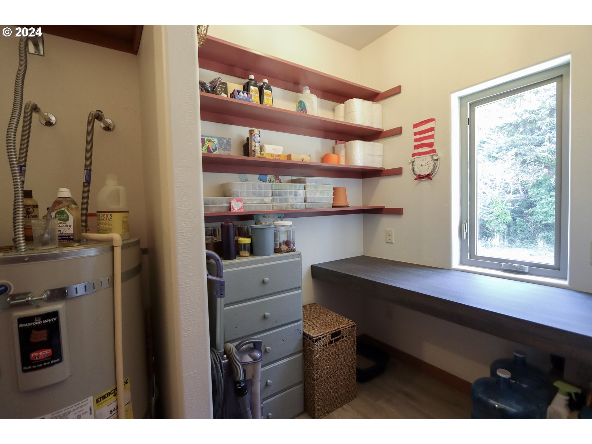 1310 Riverside Drive Northeast Bandon, OR 97411 - Photo 19 of 42 a room with a window and cabinets