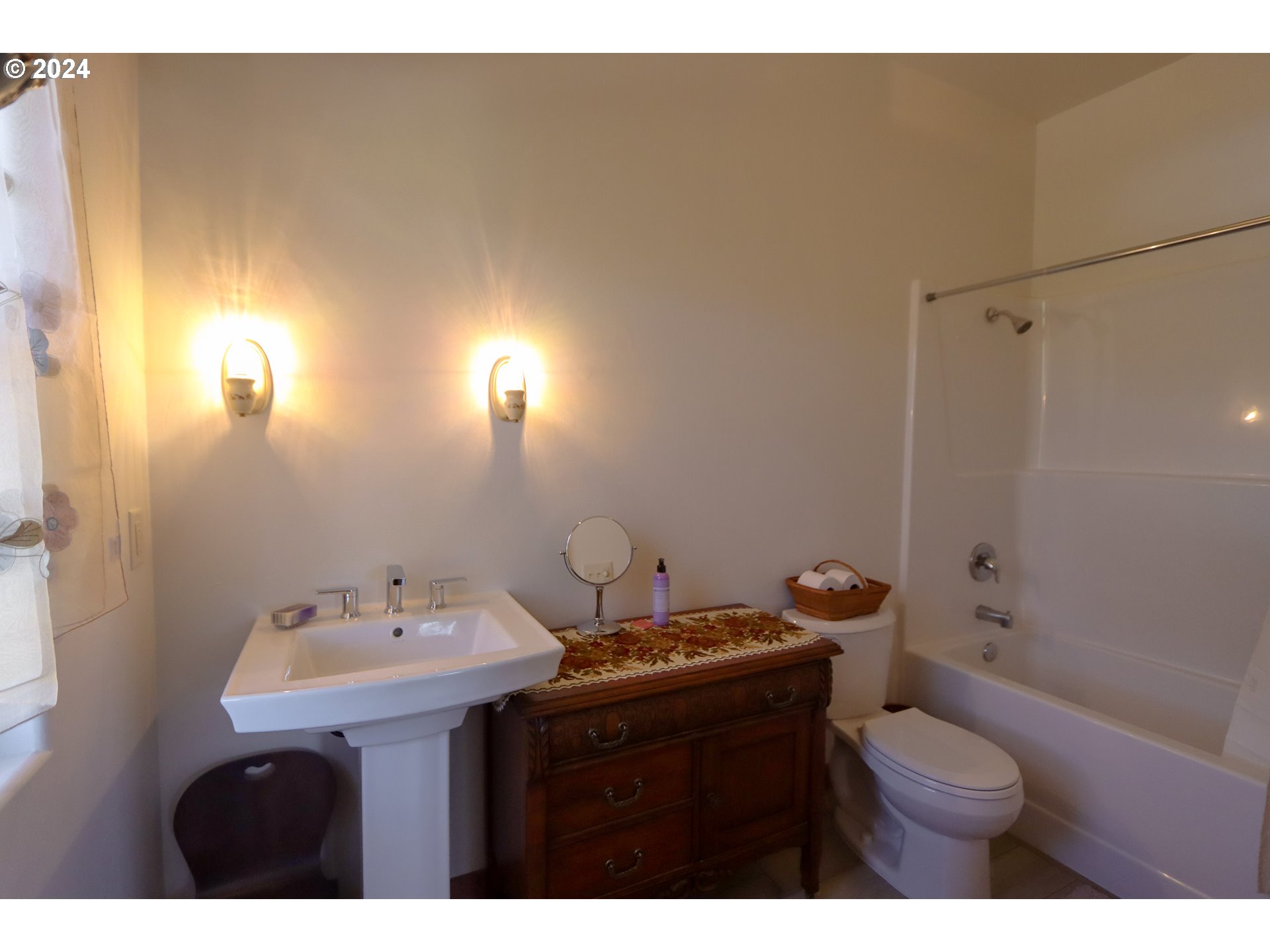 1310 Riverside Drive Northeast Bandon, OR 97411 - Photo 24 of 42 a bathroom with a sink toilet and shower