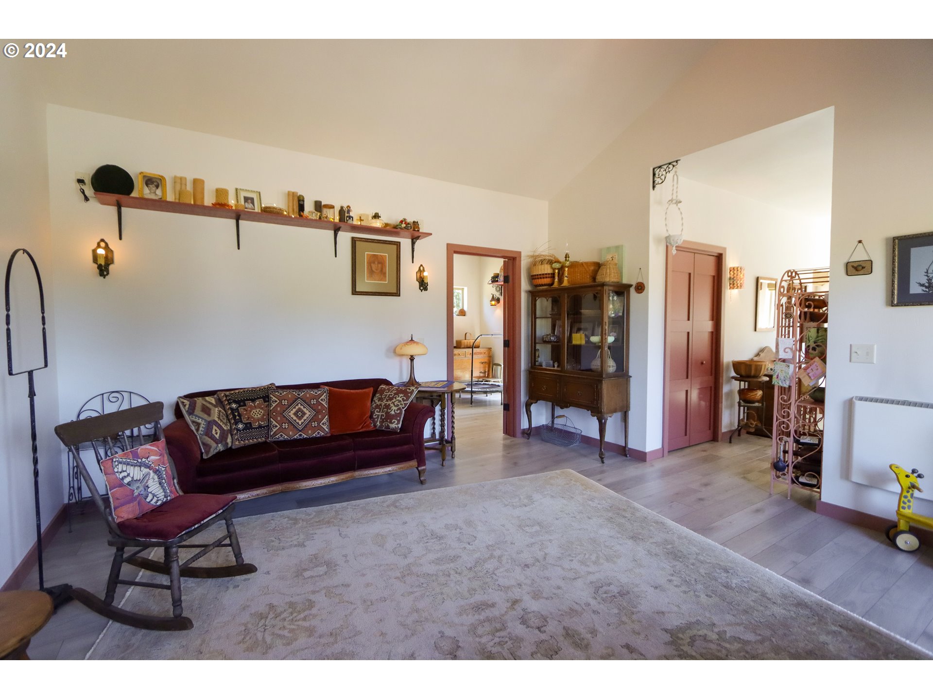 1310 Riverside Drive Northeast Bandon, OR 97411 - Photo 4 of 42 a living room with furniture and a walk in closet