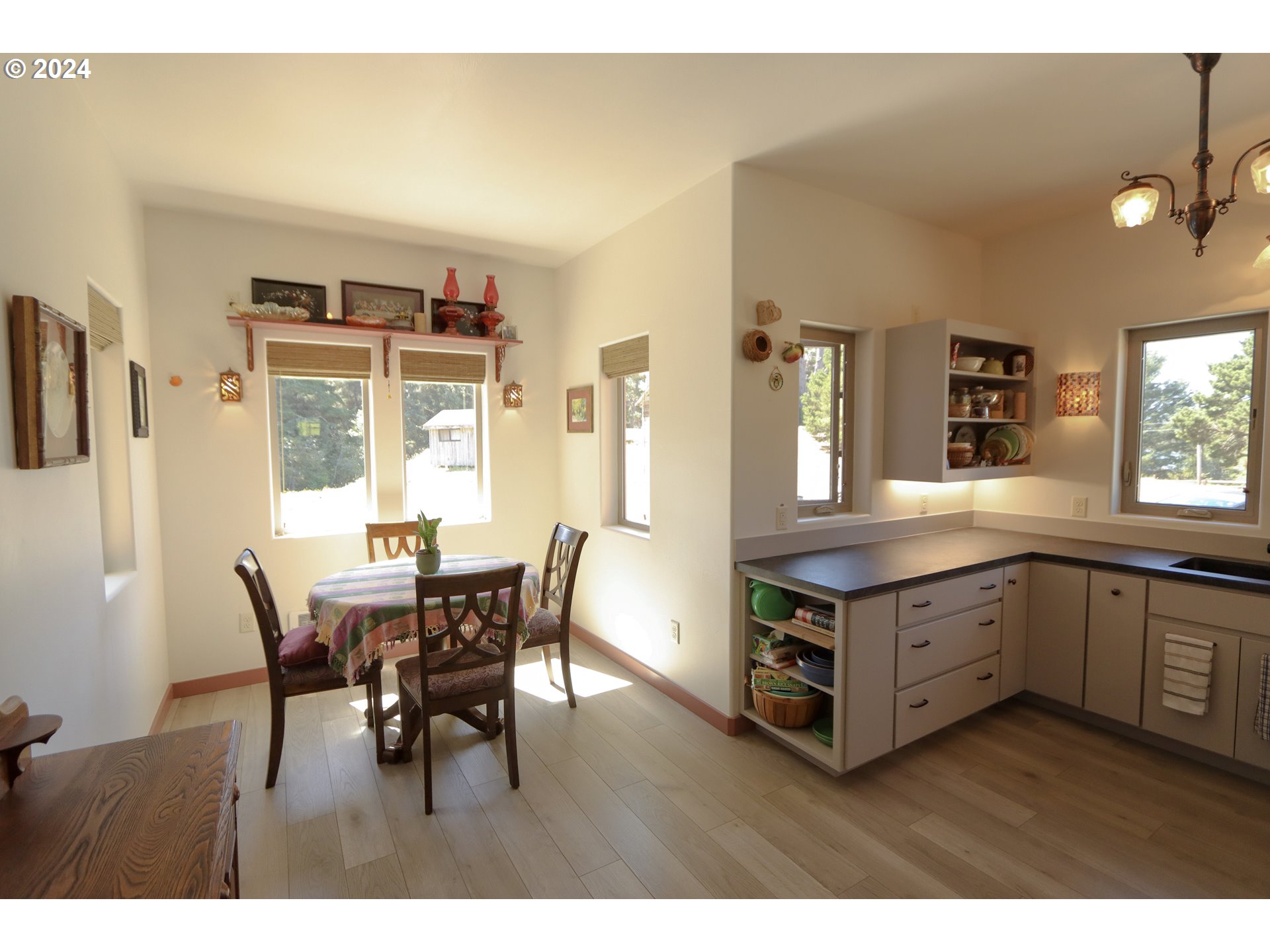 1310 Riverside Drive Northeast Bandon, OR 97411 - Photo 5 of 42 a view of a dining room with furniture and window