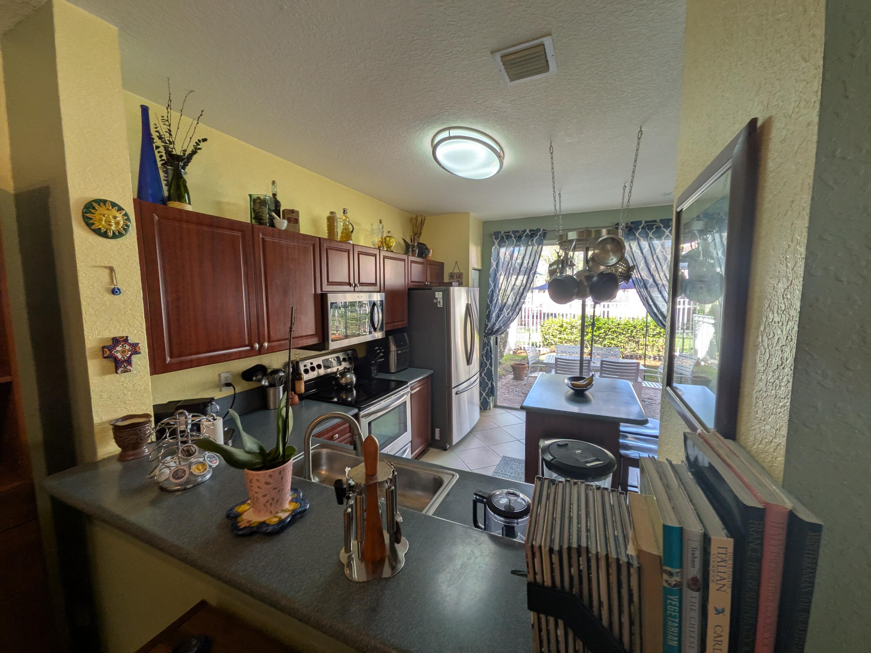 4091 Northwest 91st Terrace Sunrise, FL 33351 - Photo 11 of 41 a view of a dining room with furniture window and outside view