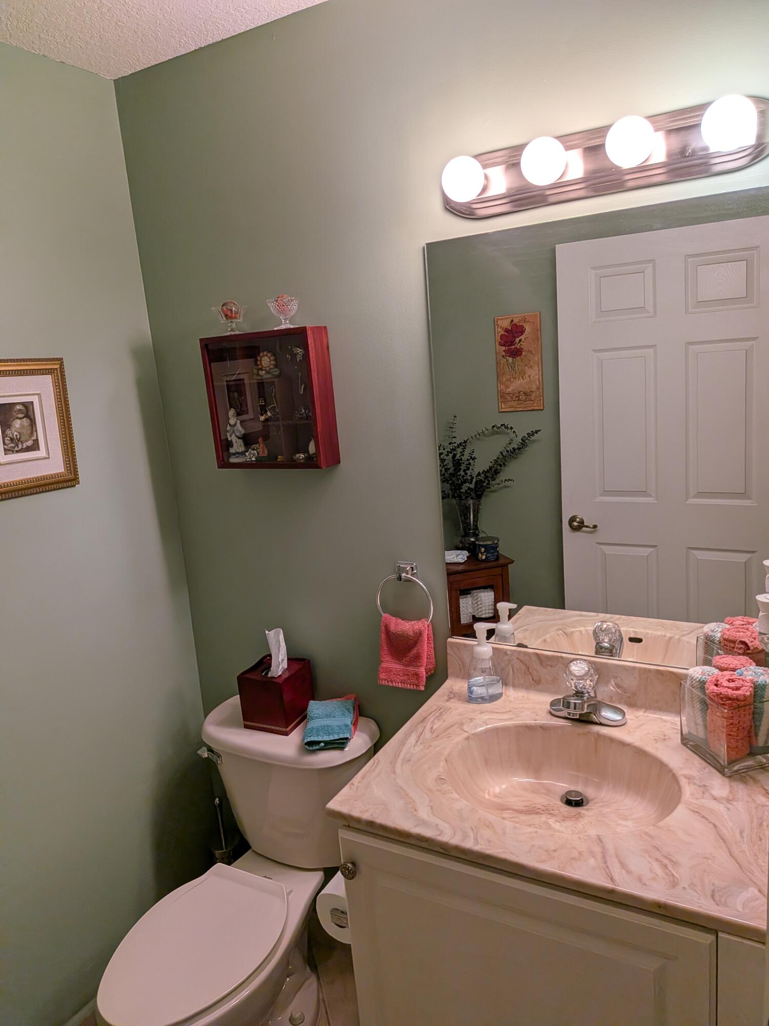4091 Northwest 91st Terrace Sunrise, FL 33351 - Photo 15 of 41 a bathroom with a sink mirror and toilet