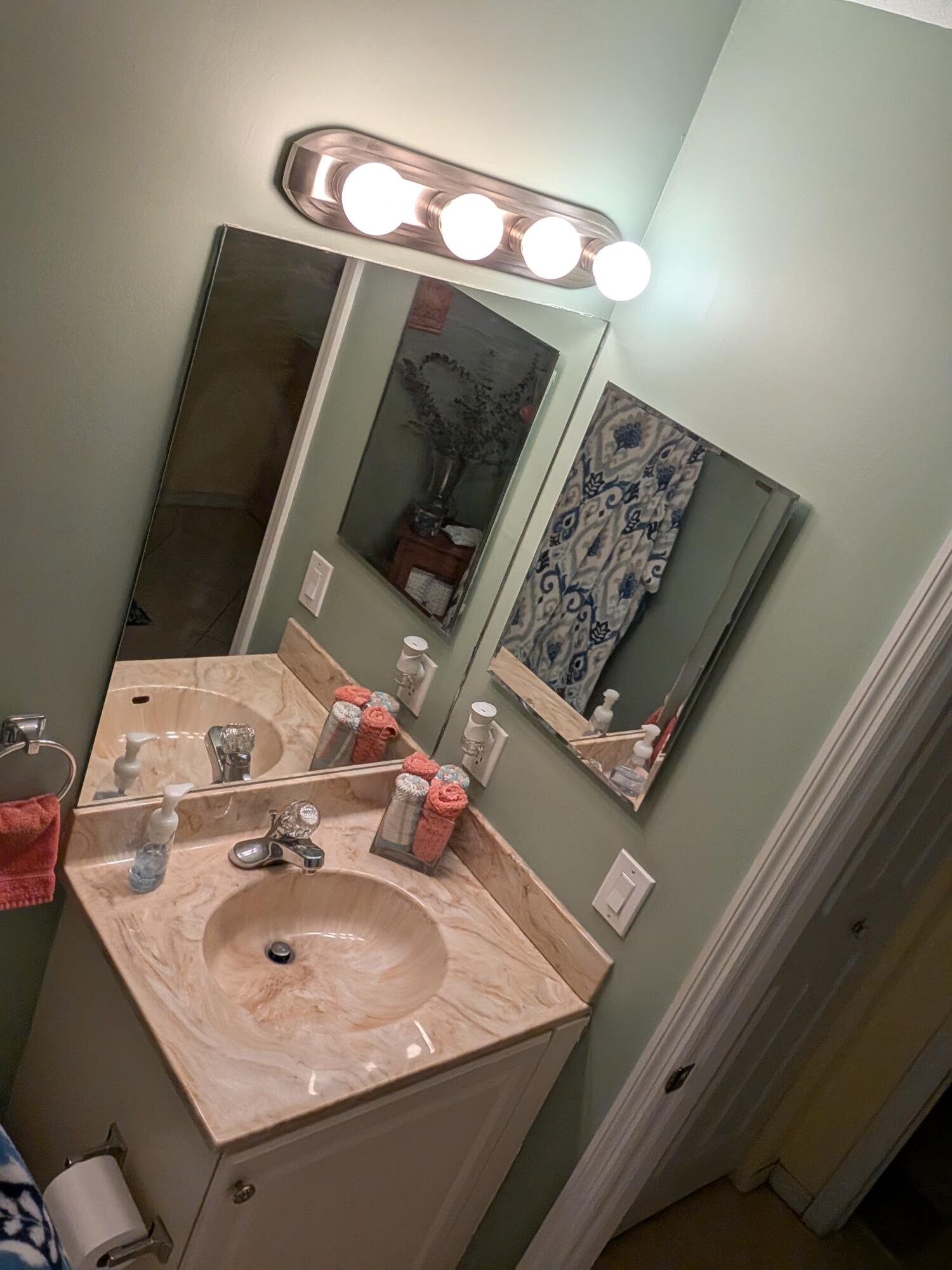 4091 Northwest 91st Terrace Sunrise, FL 33351 - Photo 17 of 41 a bathroom with a sink and mirror