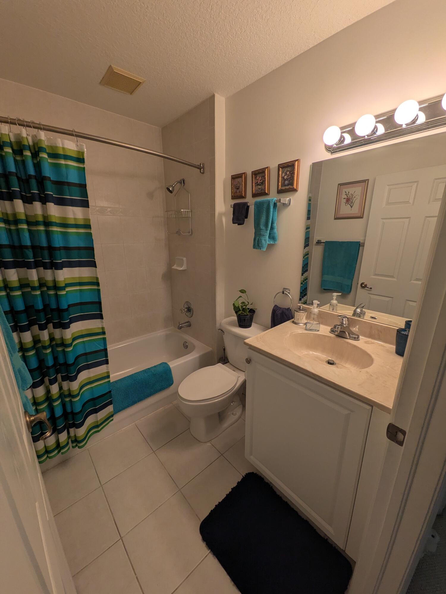 4091 Northwest 91st Terrace Sunrise, FL 33351 - Photo 30 of 41 a bathroom with a sink a toilet and shower