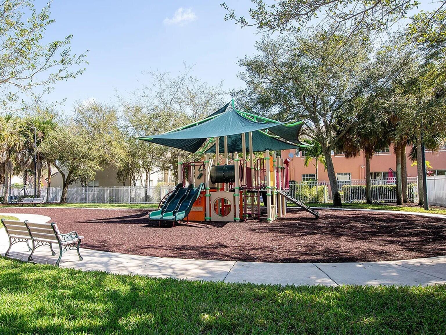 4091 Northwest 91st Terrace Sunrise, FL 33351 - Photo 3 of 41 a view of outdoor space with playground and green space