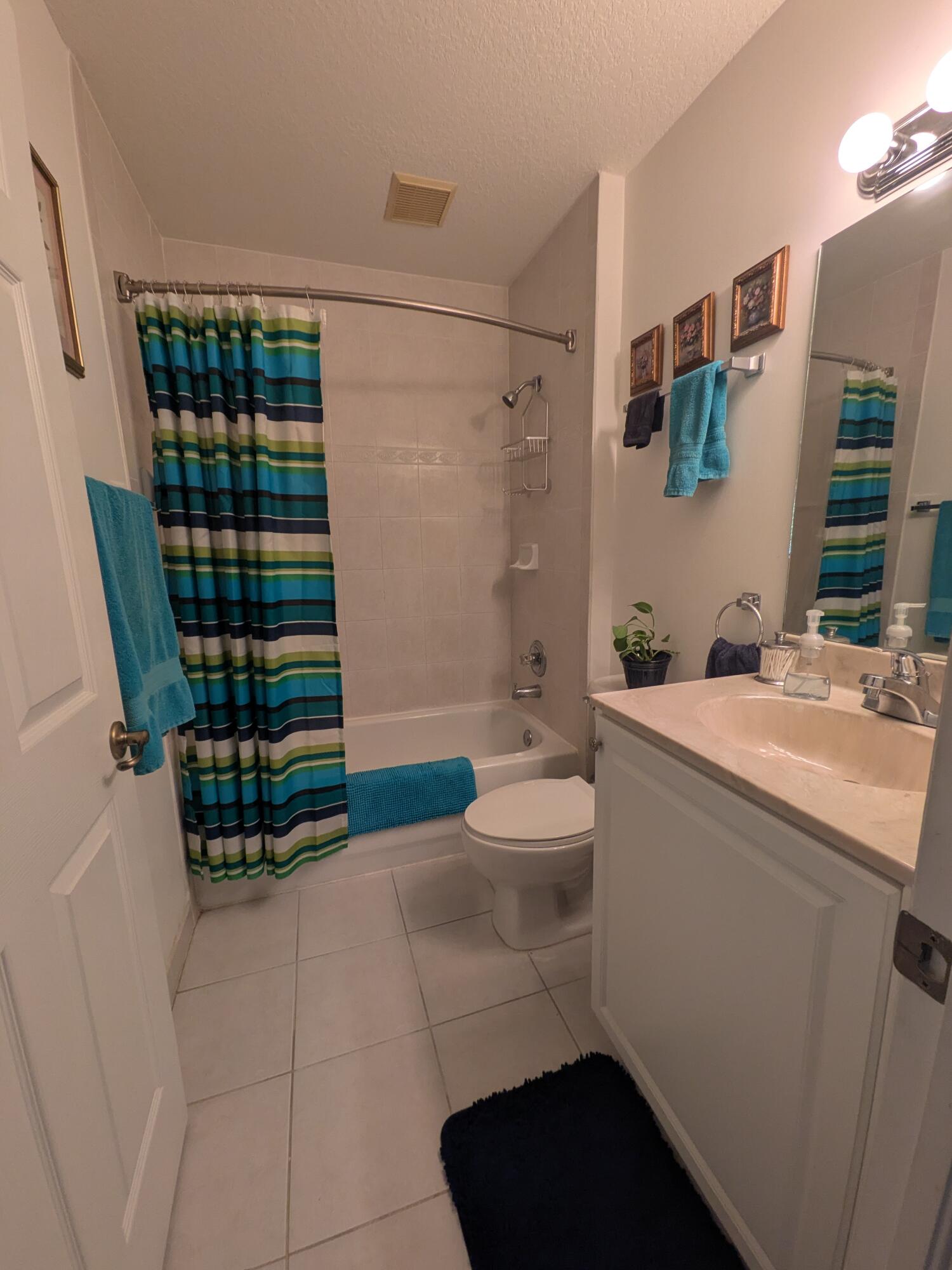 4091 Northwest 91st Terrace Sunrise, FL 33351 - Photo 31 of 41 a bathroom with a sink toilet and shower