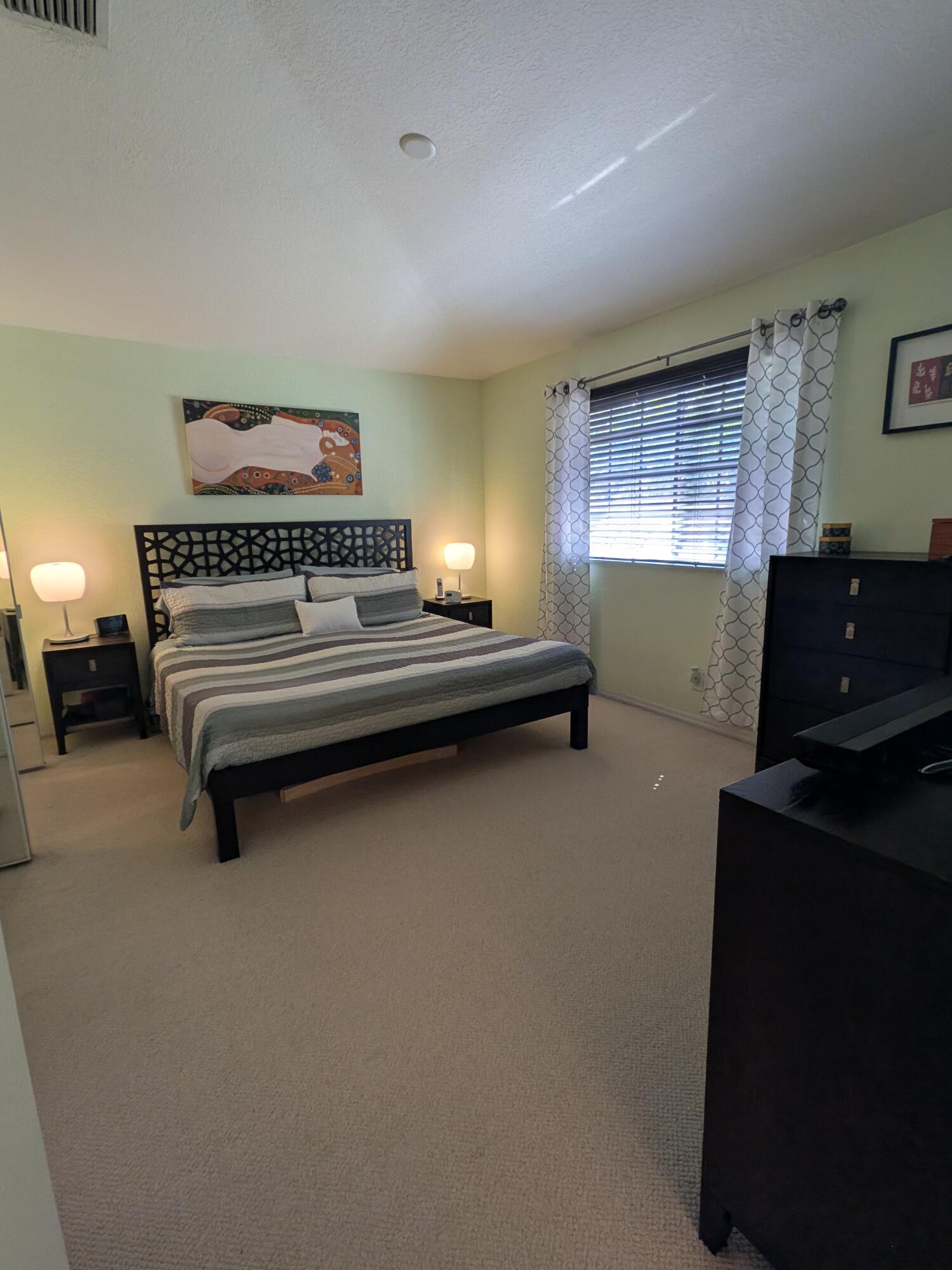 4091 Northwest 91st Terrace Sunrise, FL 33351 - Photo 34 of 41 a bedroom with furniture and window