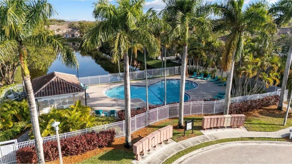 4091 Northwest 91st Terrace Sunrise, FL 33351 - Photo 4 of 41 a view of backyard with swimming pool and outdoor seating