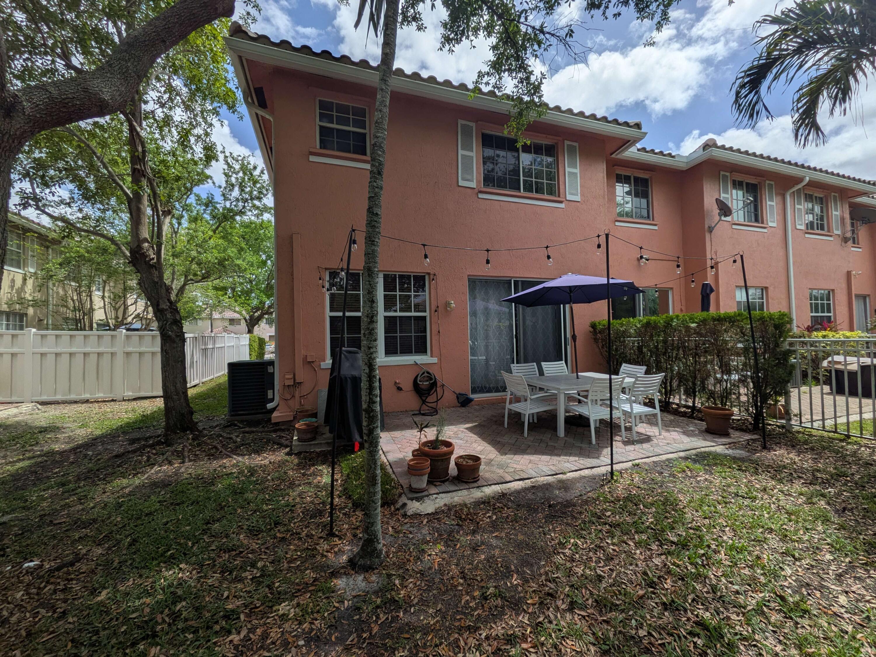 4091 Northwest 91st Terrace Sunrise, FL 33351 - Photo 41 of 41 a view of backyard of house with outdoor seating and green space