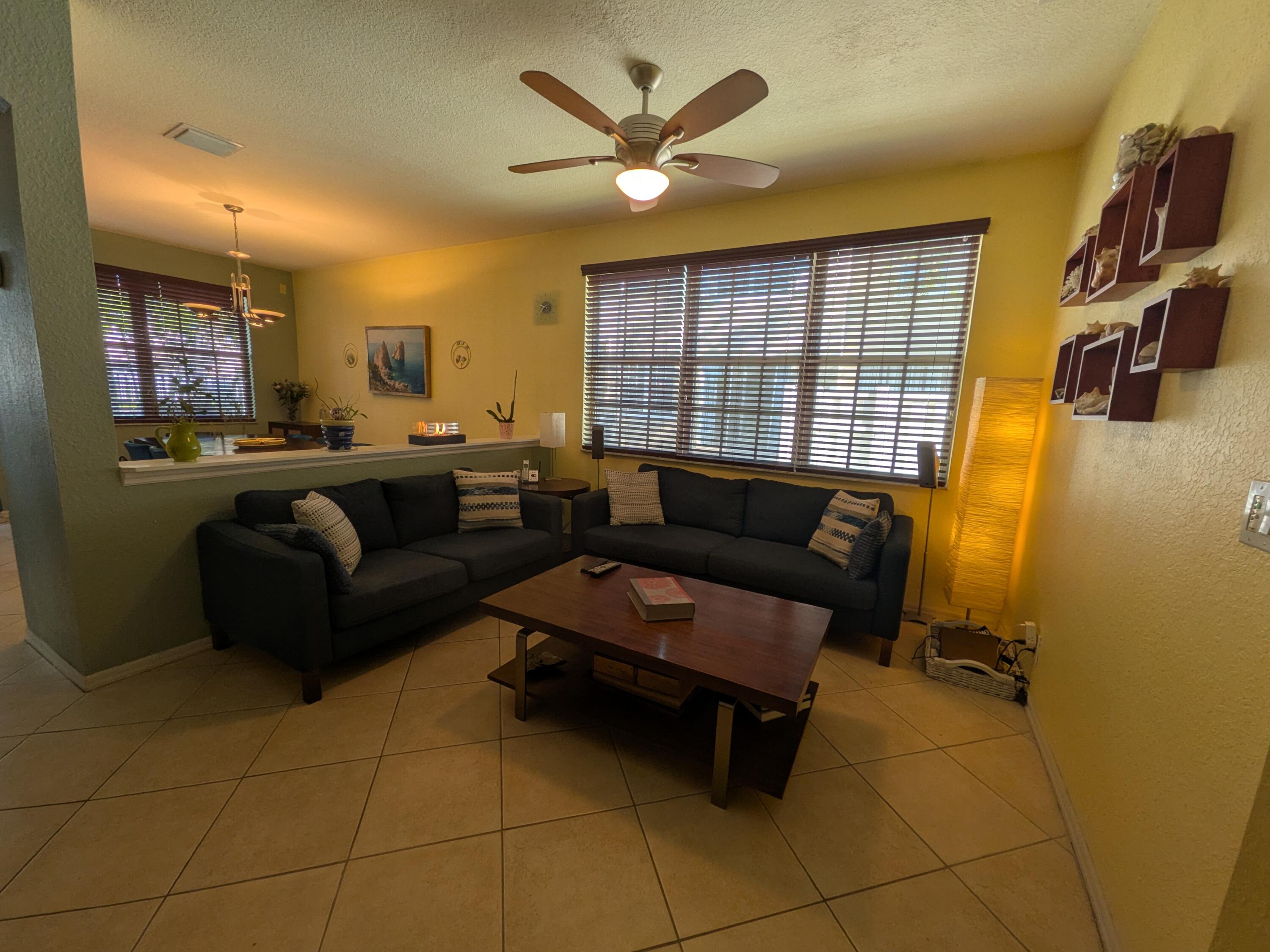 4091 Northwest 91st Terrace Sunrise, FL 33351 - Photo 6 of 41 a living room with furniture and a large window