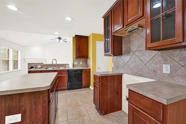 a kitchen with a stove a sink and a refrigerator