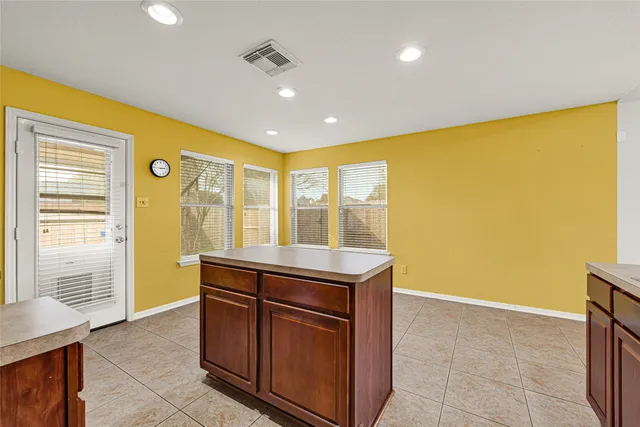 a kitchen with a sink and a refrigerator