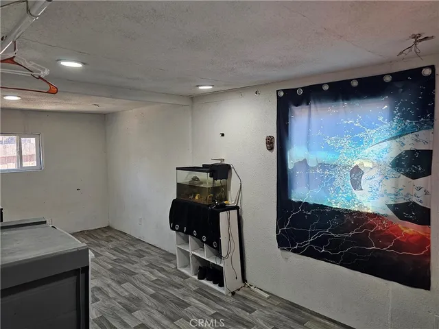 a room with furniture and wooden floor