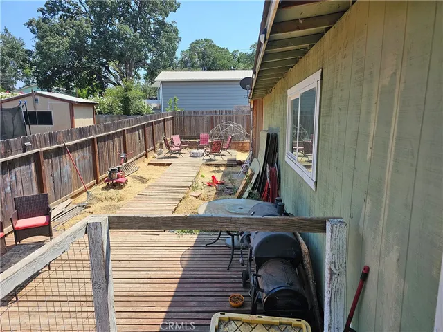 a view of a balcony with furniture