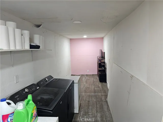 a view of storage and utility room with washer and dryer
