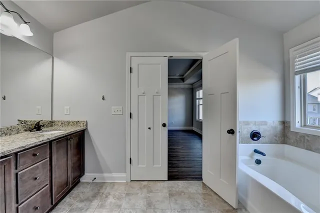 a view of a brick house with large windows