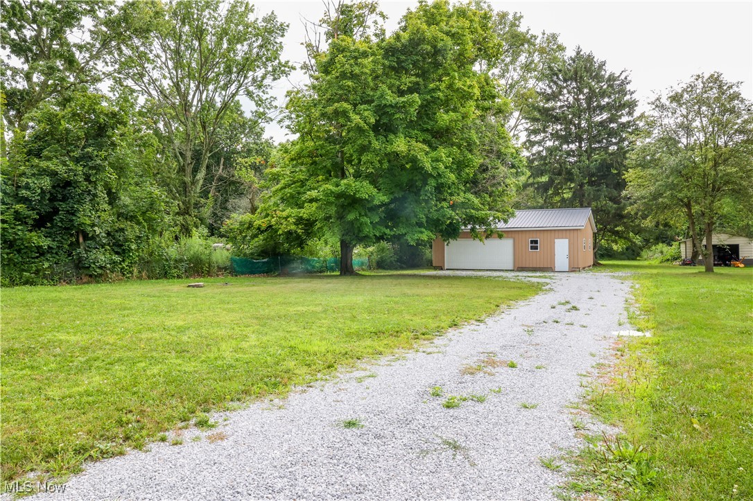 3181 Dover Road Wooster, OH 44691 - Photo 18 of 25 View of yard featuring an outbuilding and a garage