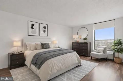 a bed room with a bed and a couch