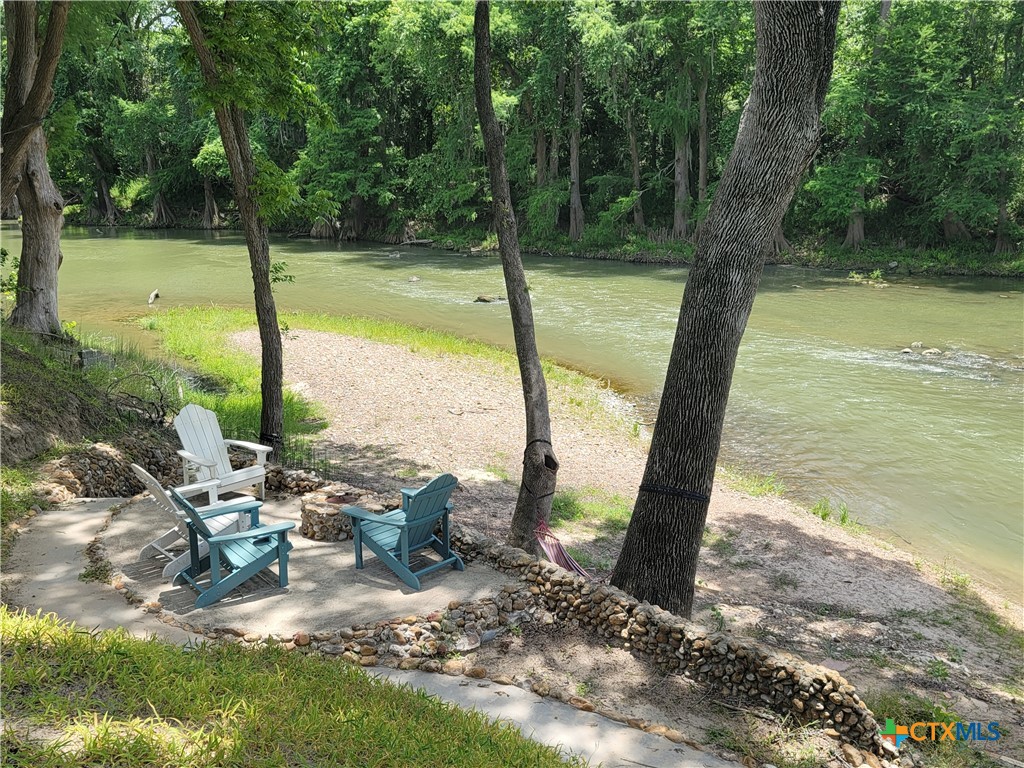 582 Cypress Valley Road Cuero, TX 77954 - Photo 1 of 36 a view of a lake with a tree
