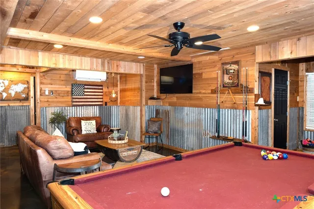 a kitchen with stainless steel appliances granite countertop a refrigerator and a stove