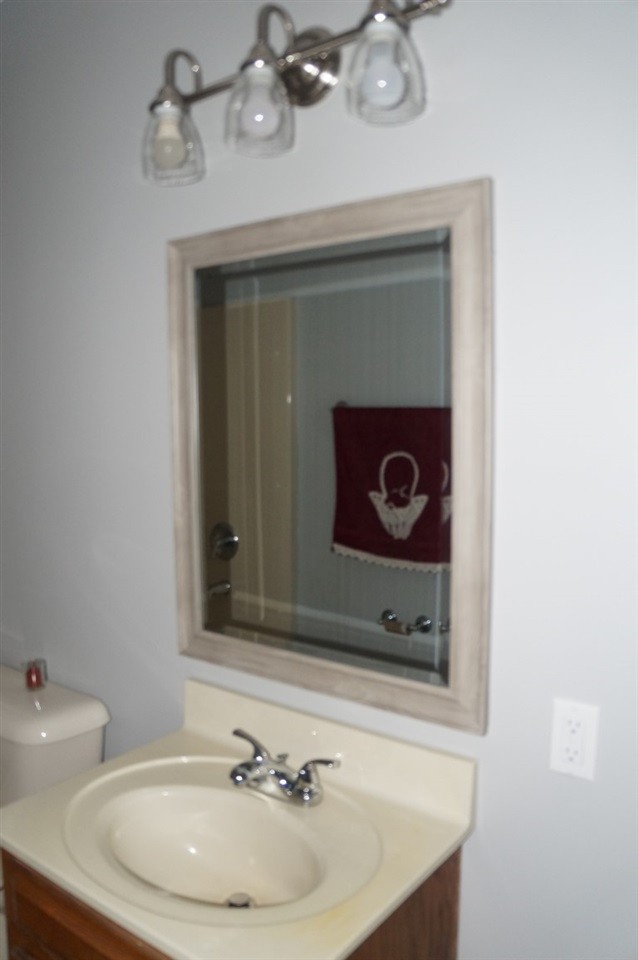 345 Yoakum Street Dayton, TN 37321 - Photo 12 of 22 a bathroom with a sink and a mirror
