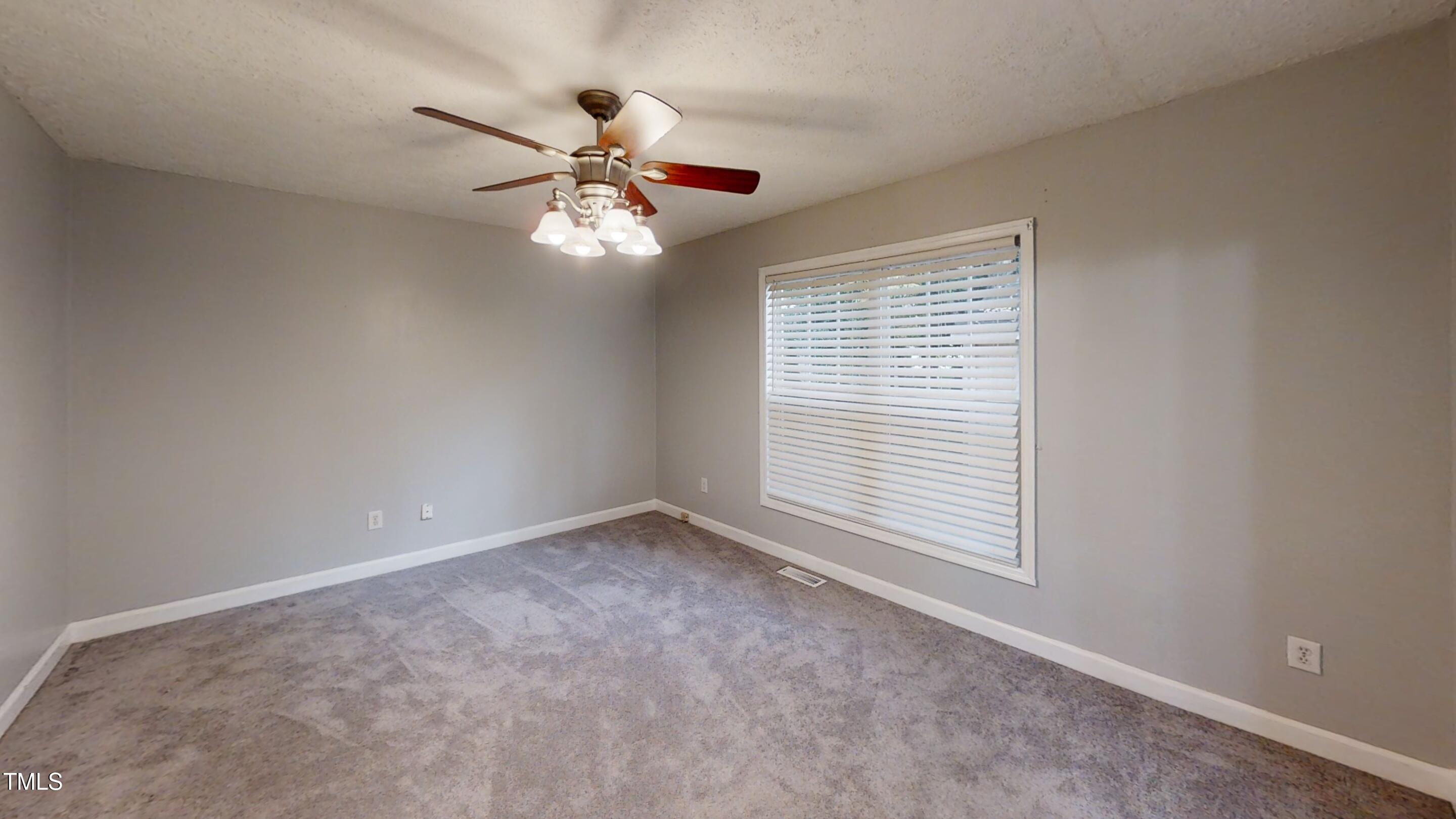 1420 East Lane Street Raleigh, NC 27610 - Photo 11 of 26 a view of an empty room with a window