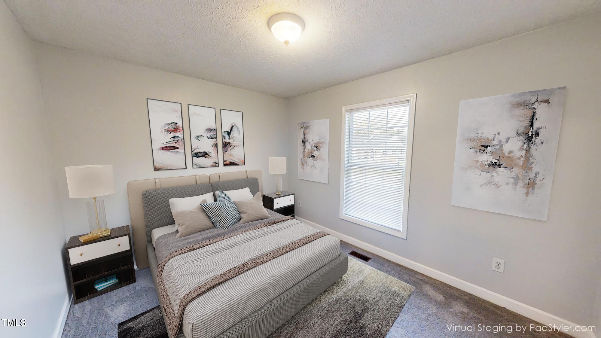 1420 East Lane Street Raleigh, NC 27610 - Photo 15 of 26 a bedroom with a bed and a window